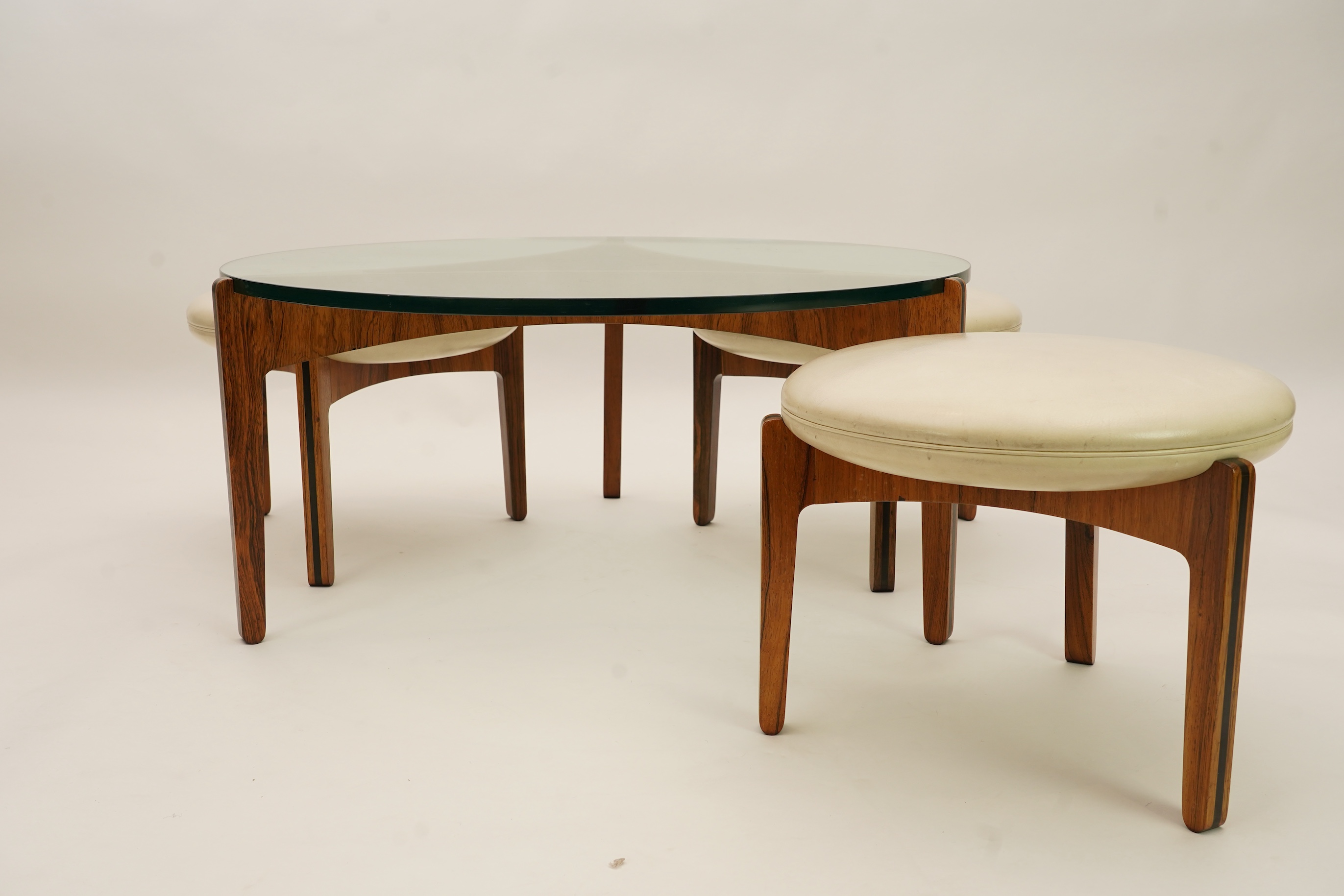 Sven Ellekaer (Danish, 1926-1984) for Christian Linneberg Møbelfabrik: A coffee table and three nesting stools ensuite